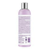 Back view of a purple bottle with text and a silver cap on a white background
