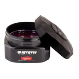Black jar of Gummy hair gel with open lid on a white background