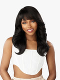 Woman with long black hair wearing a white top on a white background
