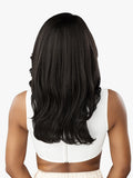 Person with long black hair wearing a white top on a white background